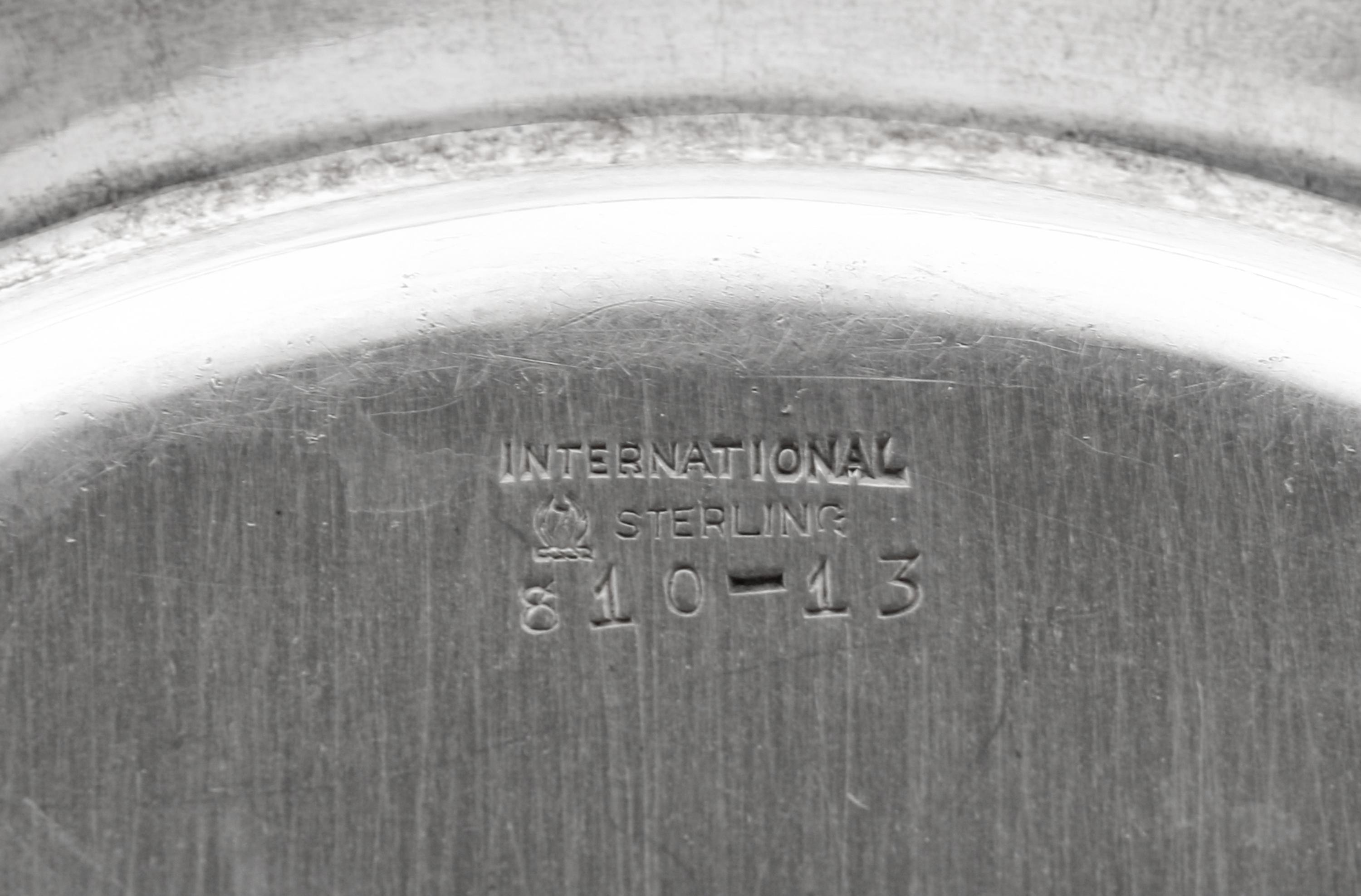 A Set of Sixteen American Silver Bread Plates