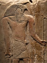 An Egyptian Limestone Round-Topped Stele