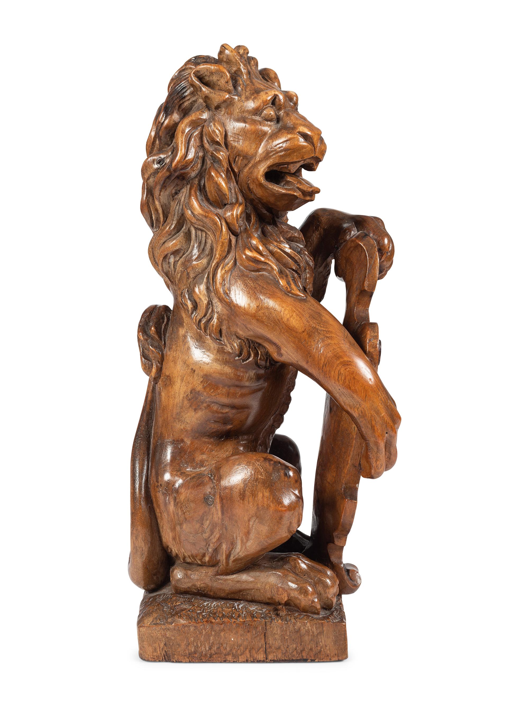 A Carved Wood Lion Newel Post Figure