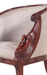 A Pair of Empire Style Carved Mahogany Swan's Neck Barrel Back Armchairs