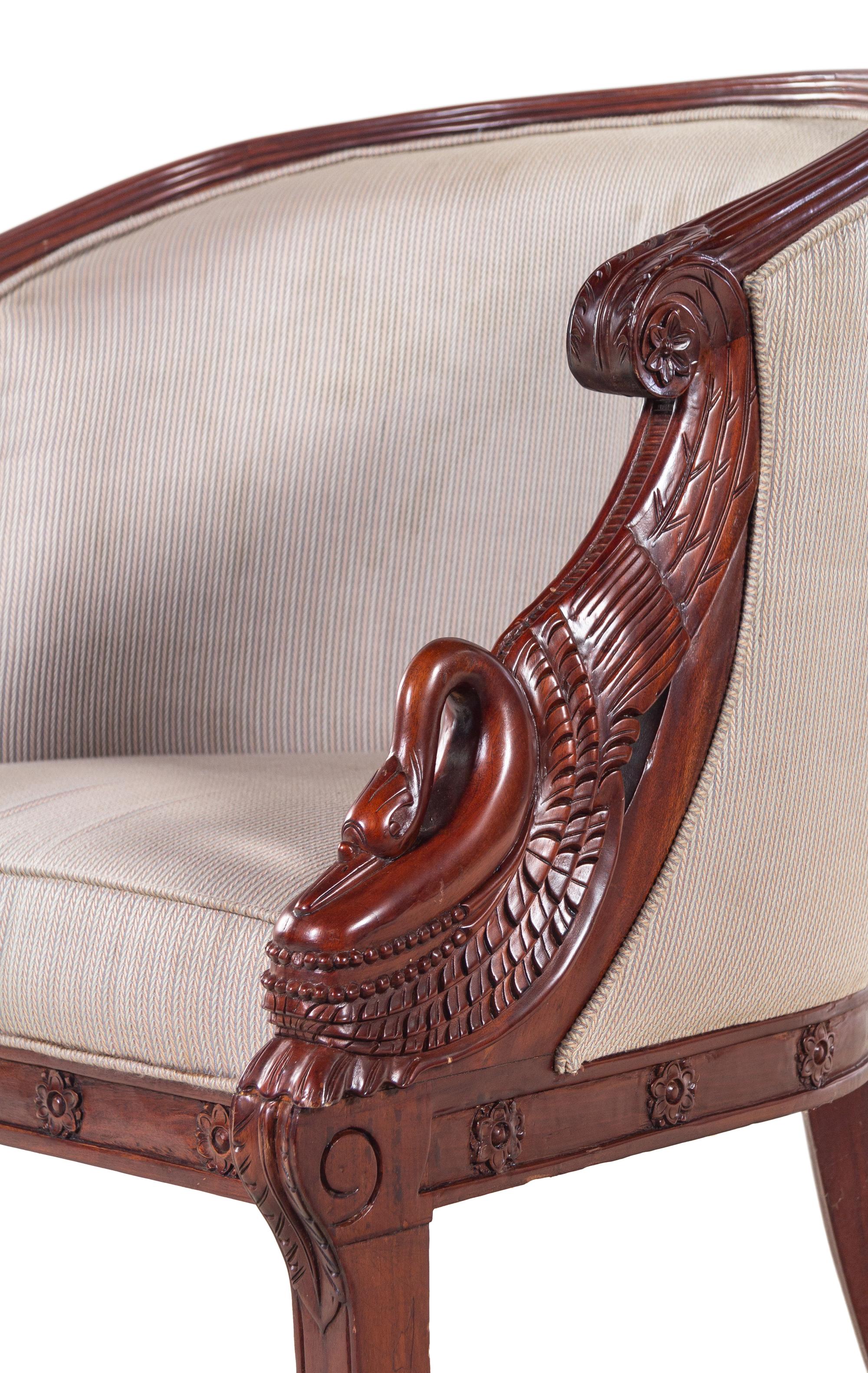 A Pair of Empire Style Carved Mahogany Swan's Neck Barrel Back Armchairs