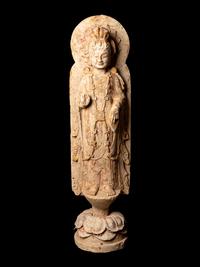 A Chinese Carved Stone Standing Buddha with Remnants of Gilt on Lotus-Form Base