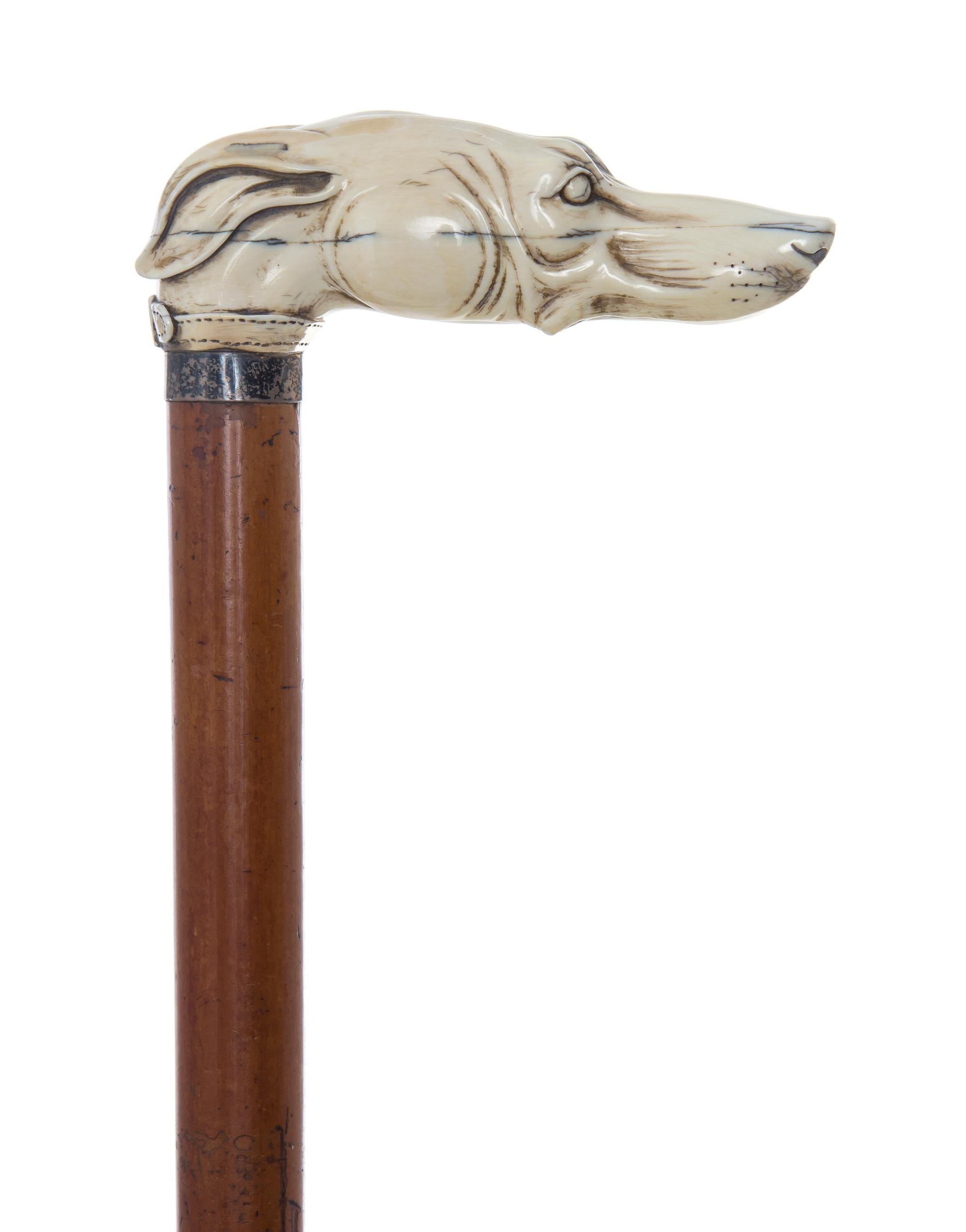 An English Ivory Handled Cane, Length of handle 4 3/4 x length overall 32 1/4 inches.