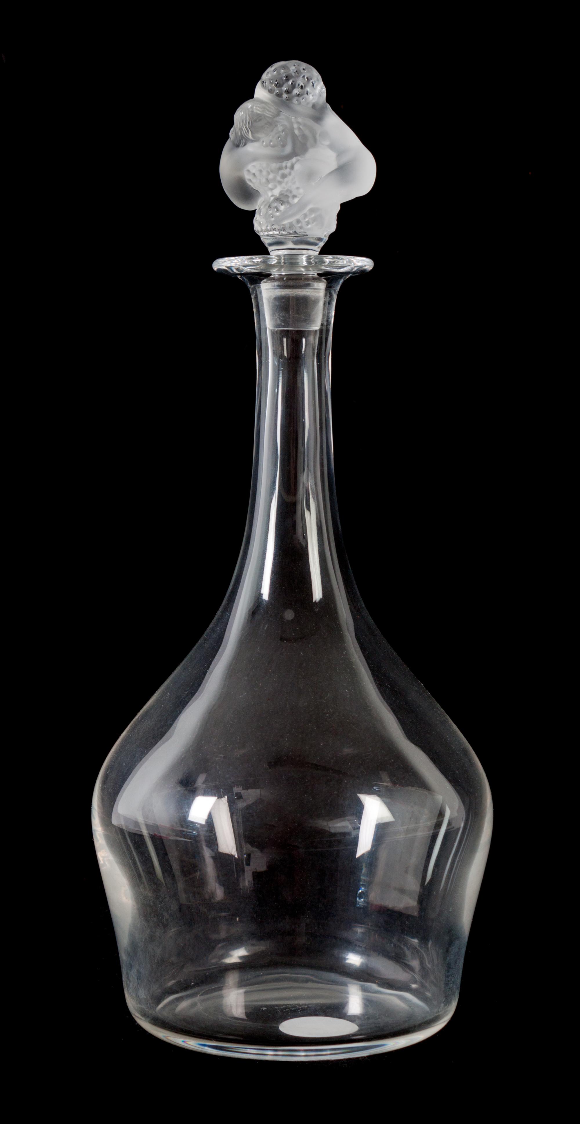 A Lalique Molded and Frosted Glass Decanter Height 12 3/4 inches. — 20TH CENTURY