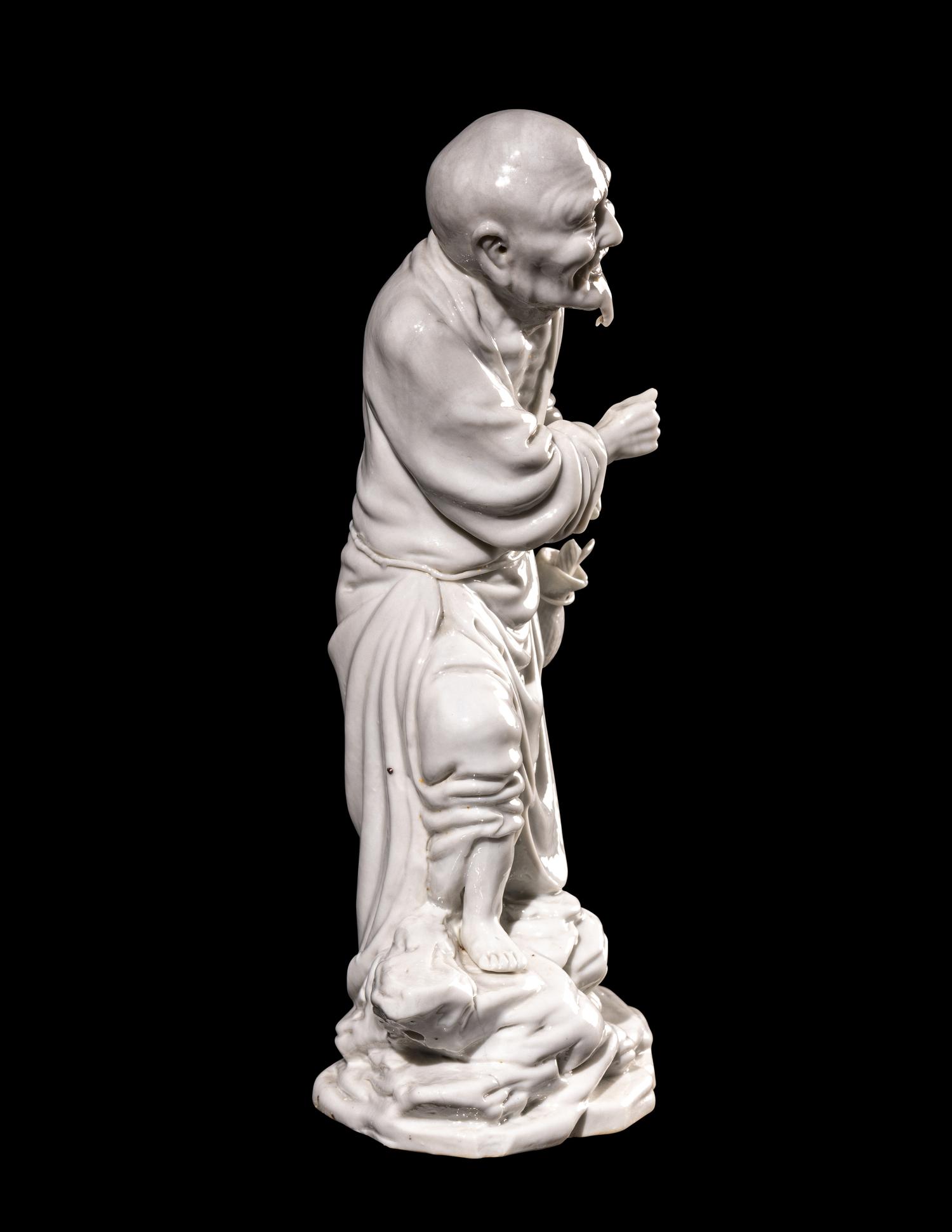 A Chinese Blanc-de-Chine Porcelain Figure of a Fisherman