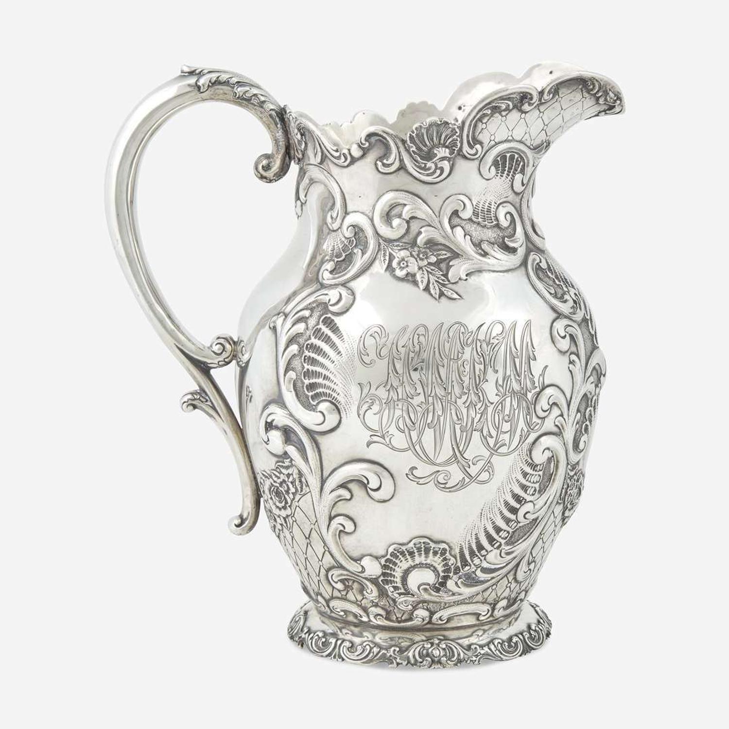 A sterling silver repoussé water pitcher Retailed by Bailey Banks & Biddle, Philadelphia, PA, late 19th century