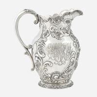 A sterling silver repoussé water pitcher Retailed by Bailey Banks & Biddle, Philadelphia, PA, late 19th century