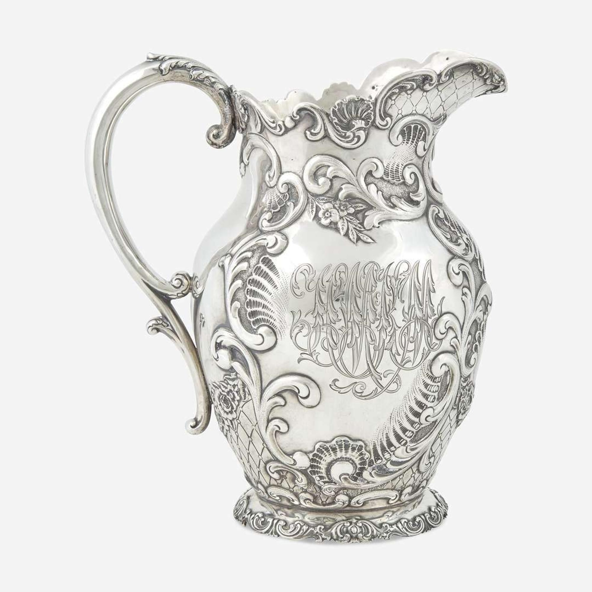 A sterling silver repoussé water pitcher Retailed by Bailey Banks & Biddle, Philadelphia, PA, late 19th century