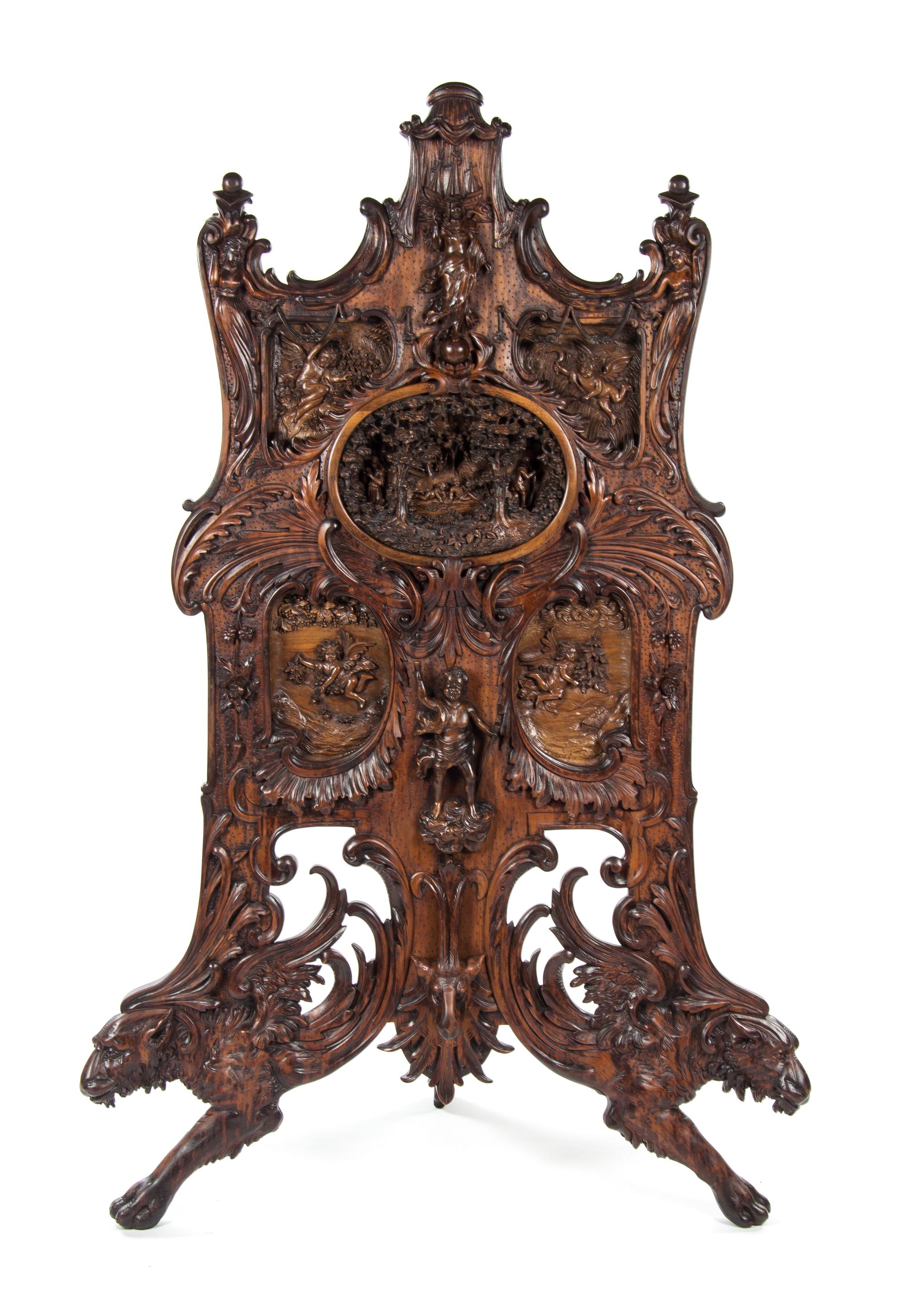 An Oversized Black Forest Carved Walnut Firescreen, Height 67 1/2 inches.