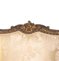 A Pair of Régence Style Carved Giltwood Fauteuils