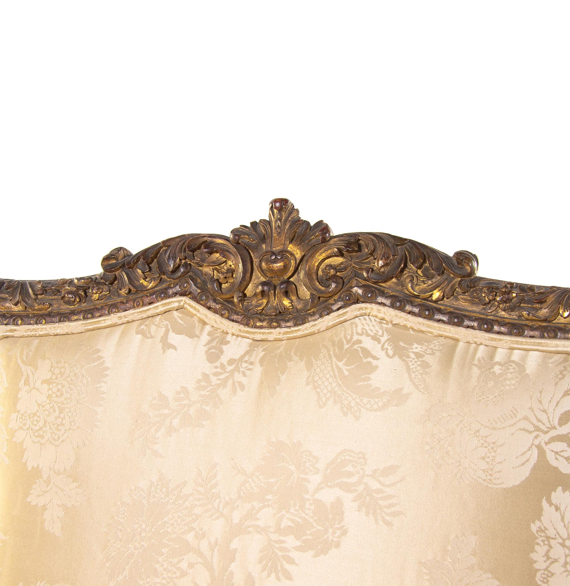 A Pair of Régence Style Carved Giltwood Fauteuils