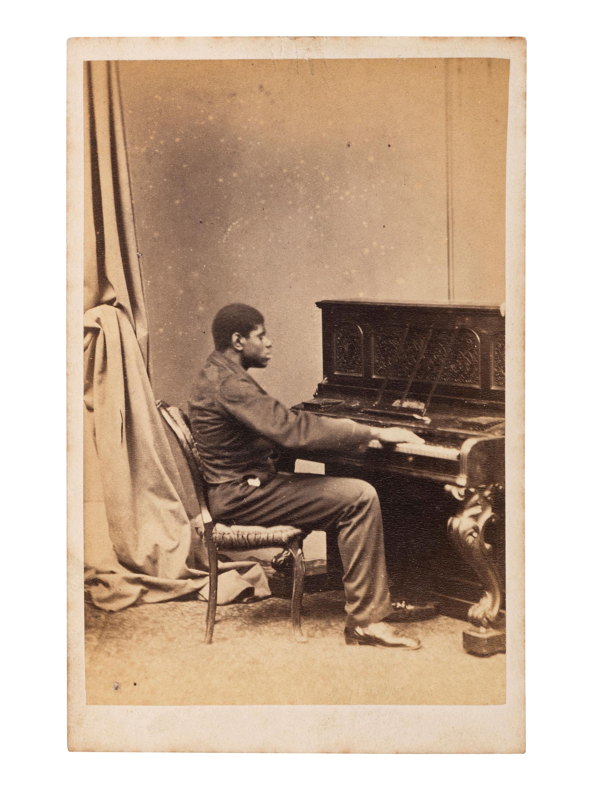 [AFRICAN AMERICANA - MUSIC]. CDV of Thomas "Blind Tom" Wiggins (1849-1908). London: Antoine Naudin, 1866.