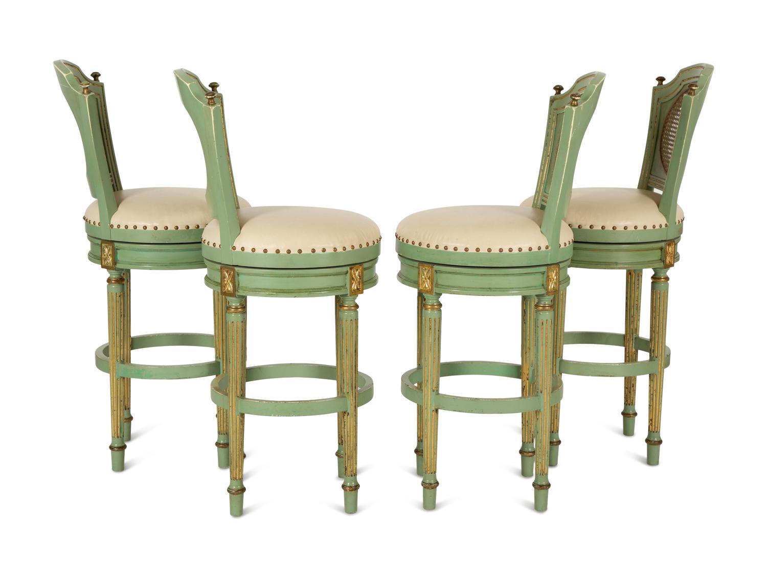 Four Louis XVI Style Painted, Parcel Gilt and Cane Back Barstools