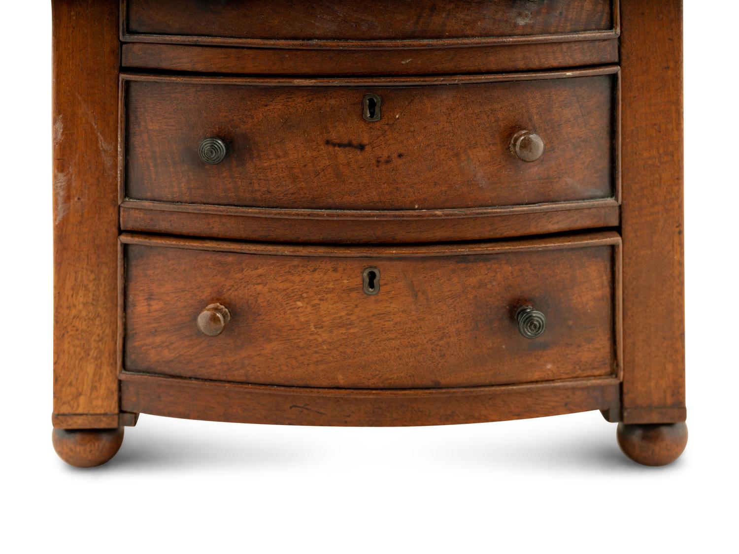 A Regency Mahogany Diminutive Bowfront Chest of Drawers