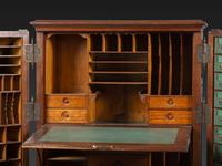 A Carved Walnut Wooton Secretary Desk