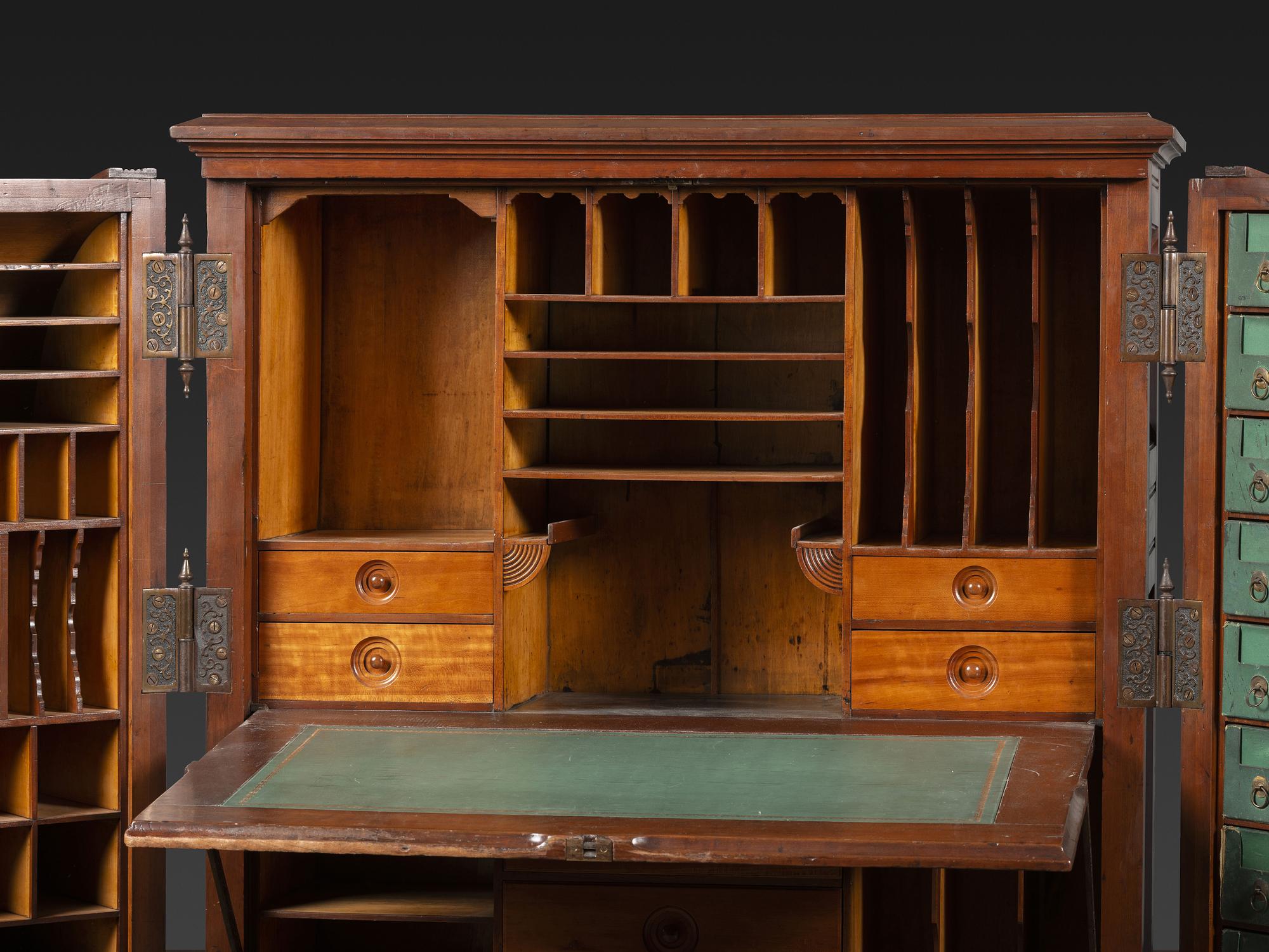 A Carved Walnut Wooton Secretary Desk