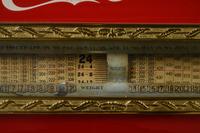 A Red Dayton Computing Scale with Coca-Cola Advertisement