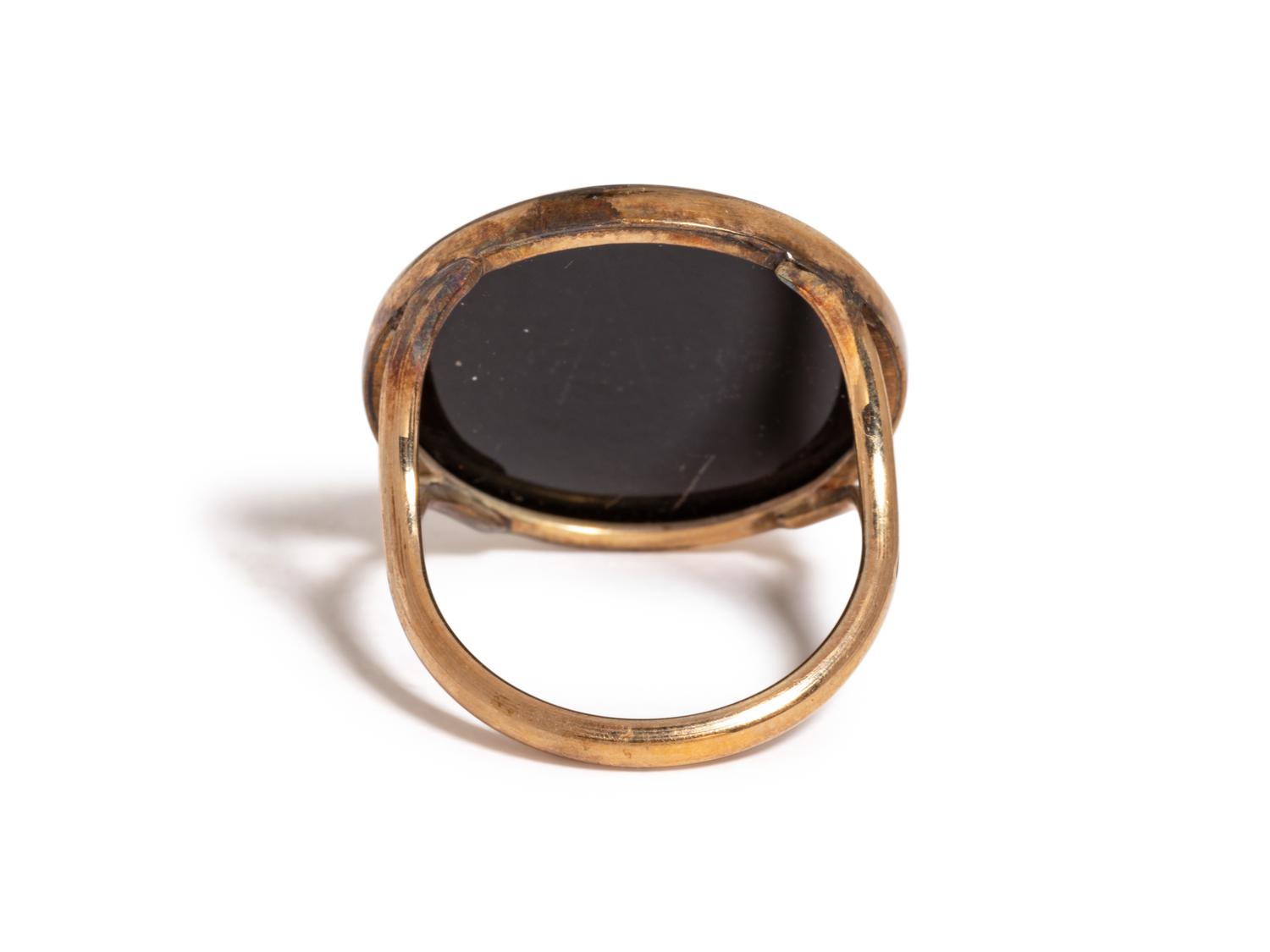 A Neoclassical Gold and Onyx Cameo Ring with a Sphinx