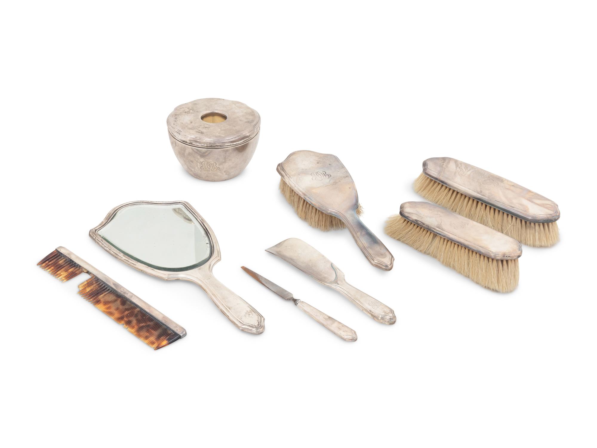 A Tiffany and Co. Silver Eight-Piece Dresser Set