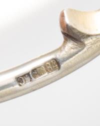 A Russian Silver and Enamel Spoon, Maker's mark obscured, Moscow, late 19th/early 20th century, having a blue enameled spherical finial
