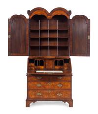 A George I Carved Burl Walnut Double-Dome Bureau Bookcase