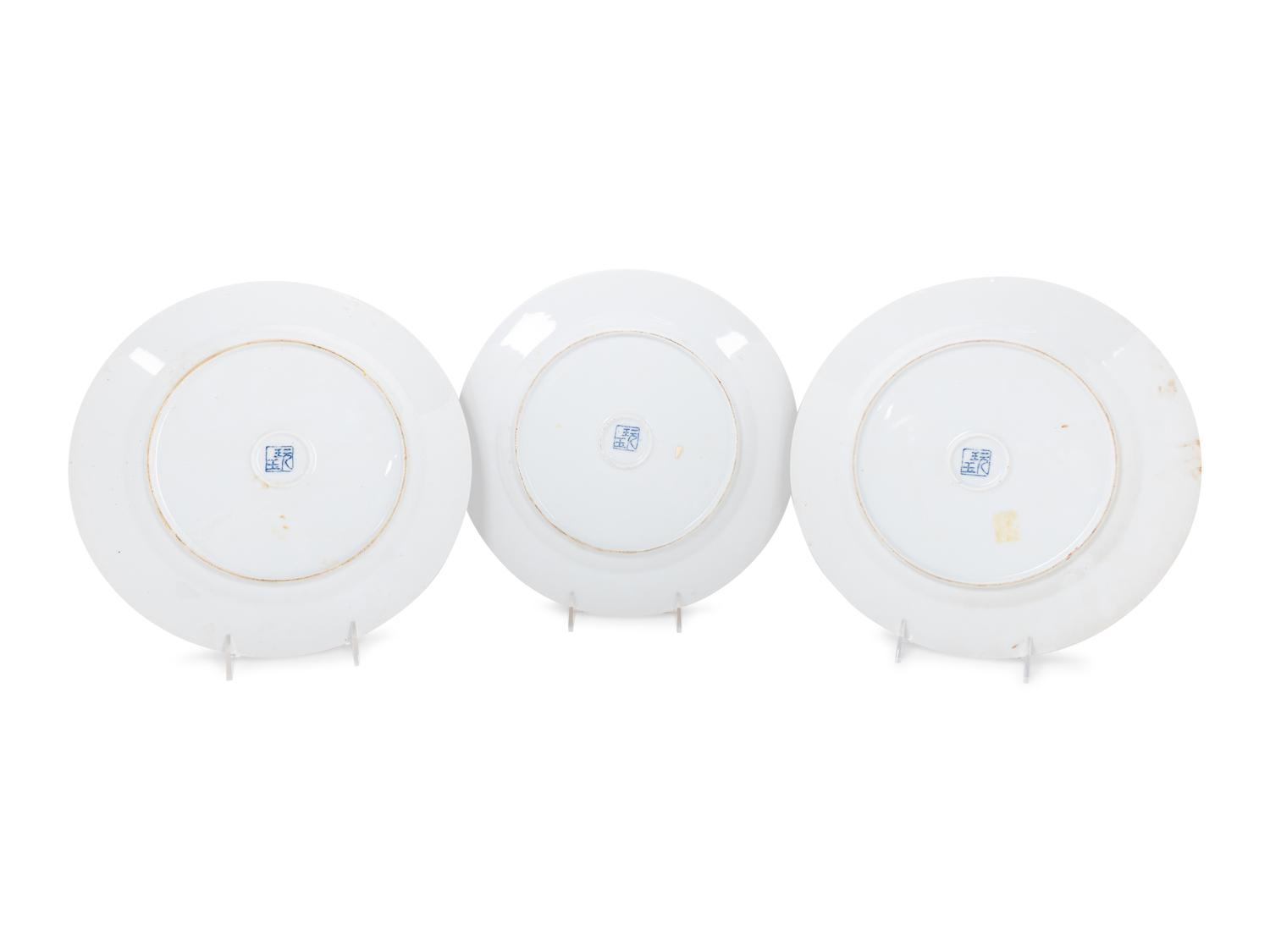 A Set of Eight "Pronk Dame au Parasol" Porcelain Chargers