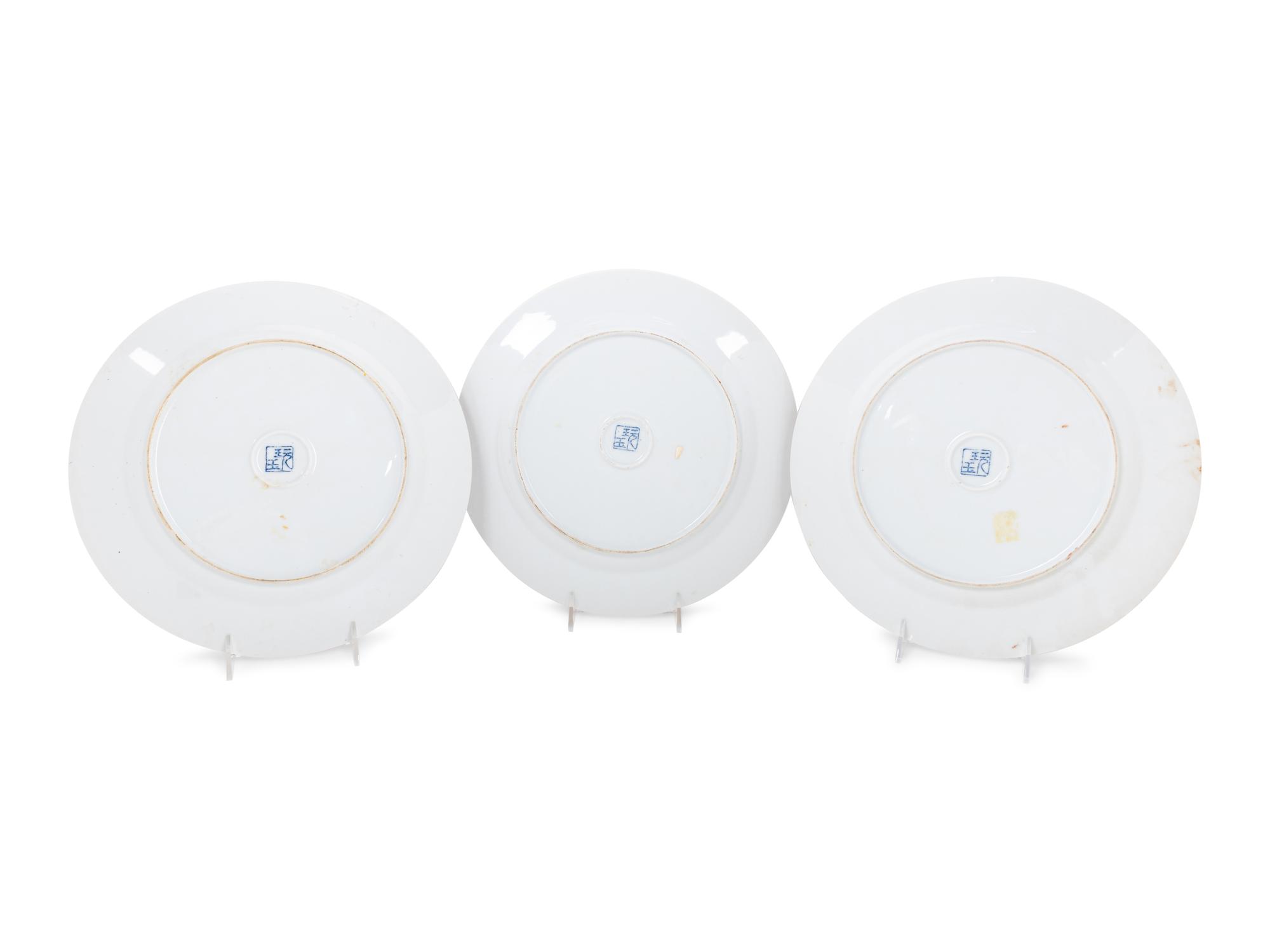 A Set of Eight "Pronk Dame au Parasol" Porcelain Chargers