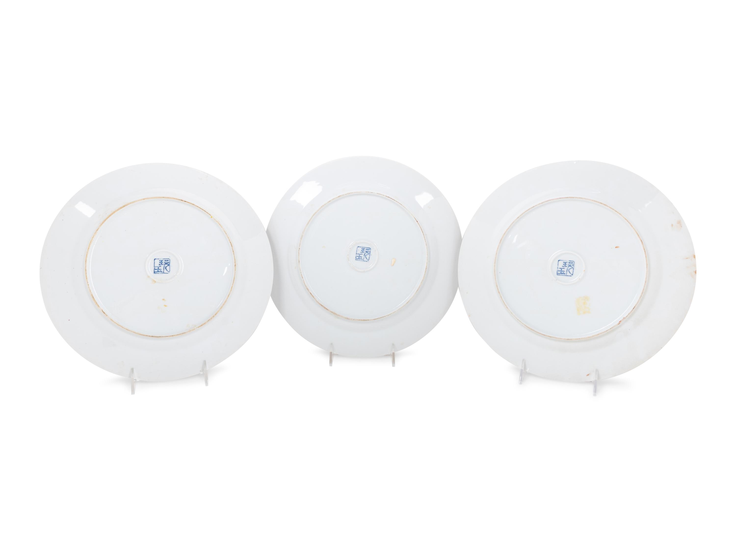 A Set of Eight "Pronk Dame au Parasol" Porcelain Chargers