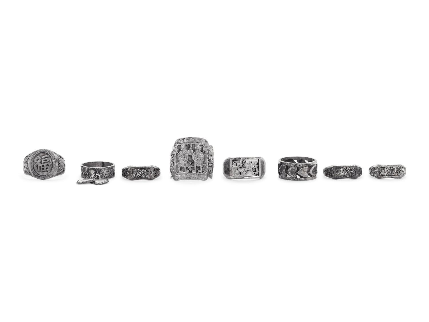 Eight Chinese Silver and Metal Rings