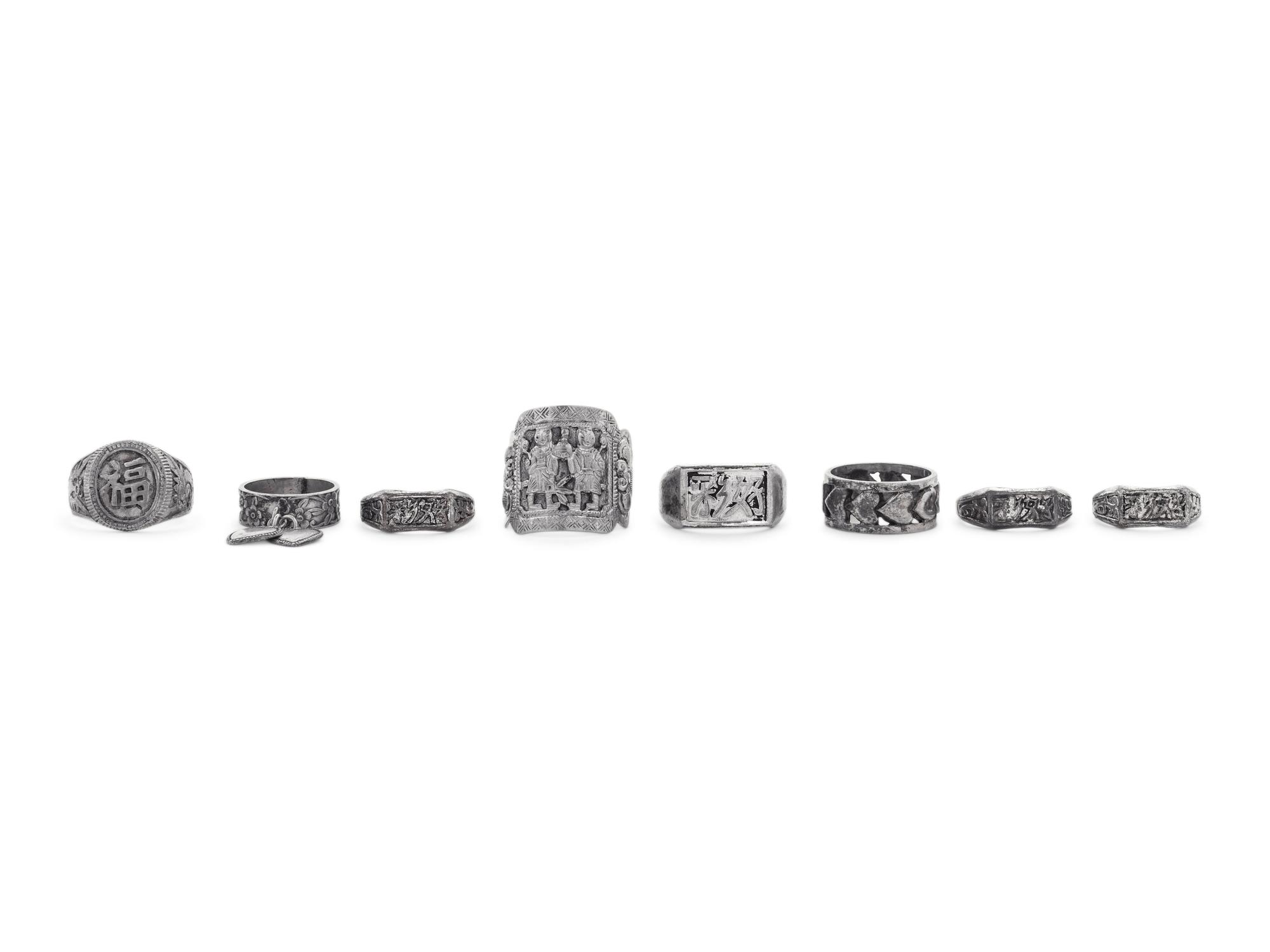 Eight Chinese Silver and Metal Rings