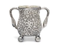 An Aesthetic Movement Sterling Silver Floral Repousse Loving Cup