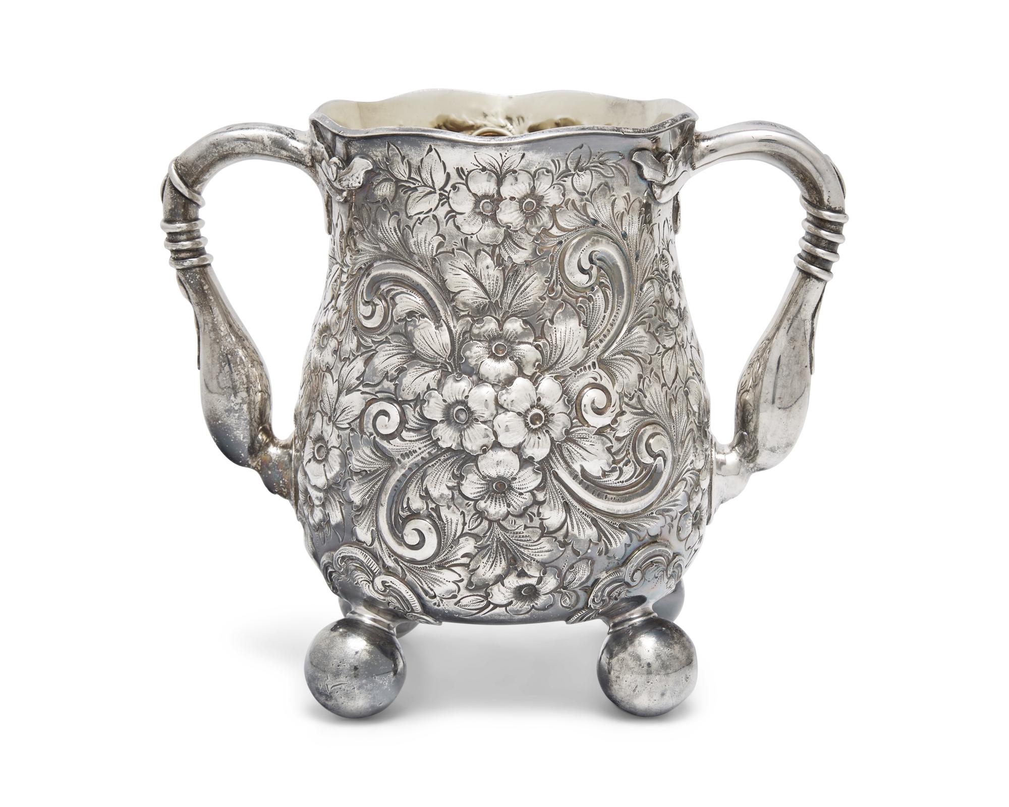 An Aesthetic Movement Sterling Silver Floral Repousse Loving Cup