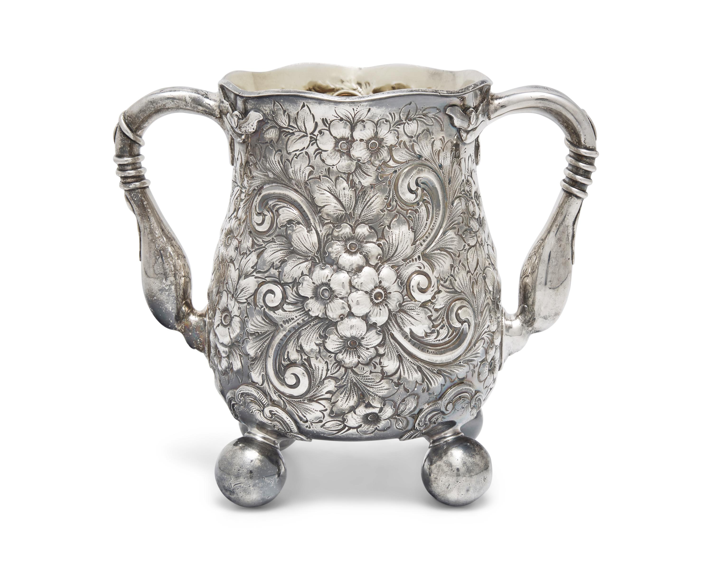An Aesthetic Movement Sterling Silver Floral Repousse Loving Cup