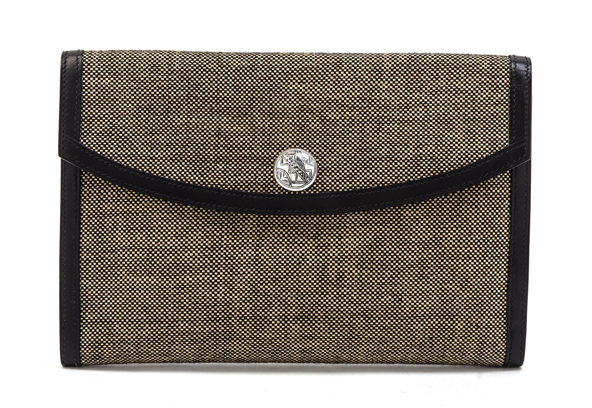 An Hermes Black and Ivory Woven Toile Clutch, 9 1/2 x 6 1/2 x 1 inches.