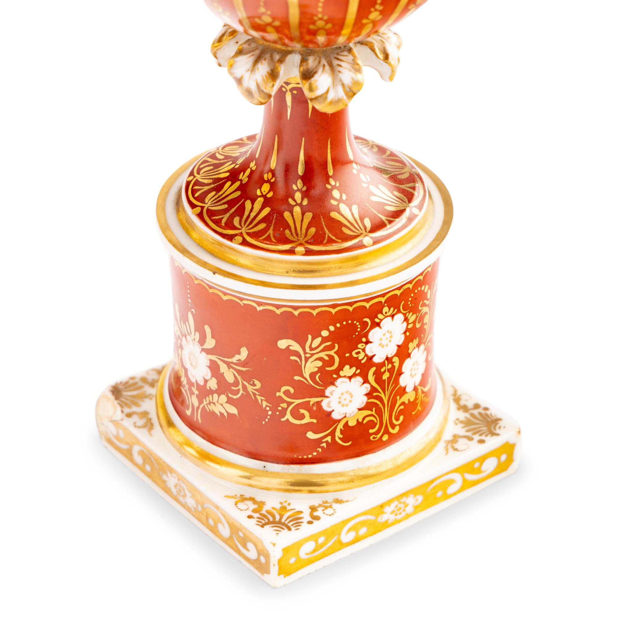 A Worcester Porcelain Hand Painted and Parcel Gilt Three-Piece Urn Garniture