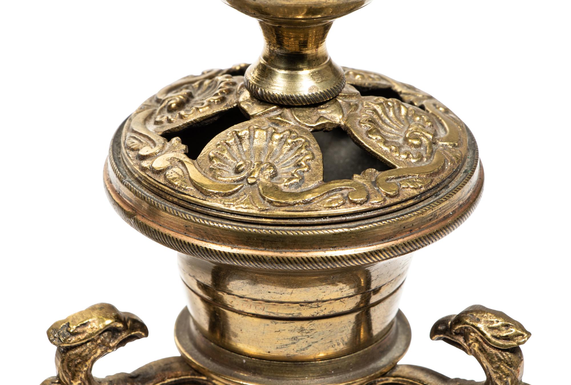 A Pair of Continental Gilt Metal Candlesticks