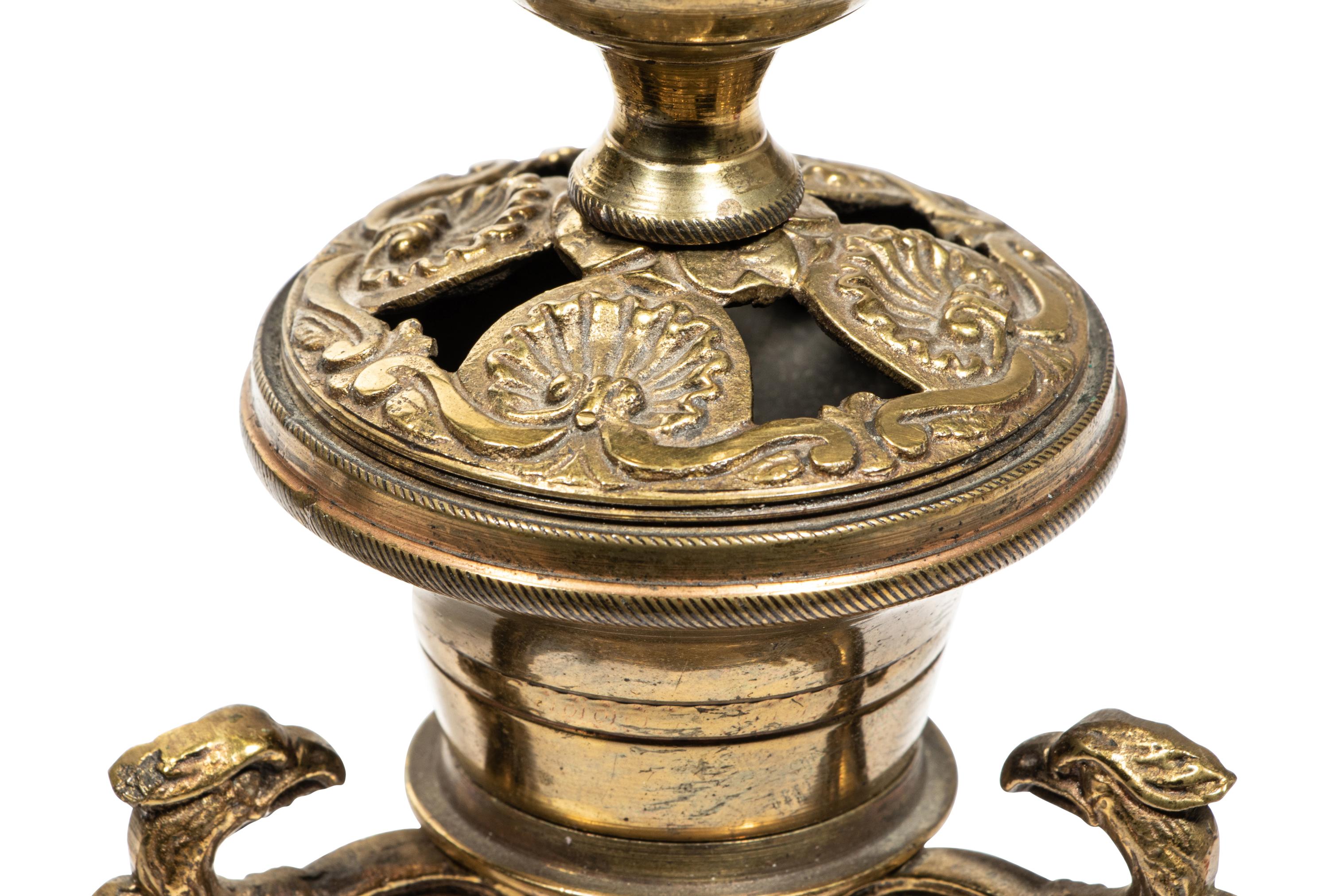 A Pair of Continental Gilt Metal Candlesticks