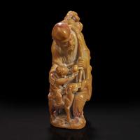 A Chinese carved soapstone figure of Shoulao 寿山石雕寿老