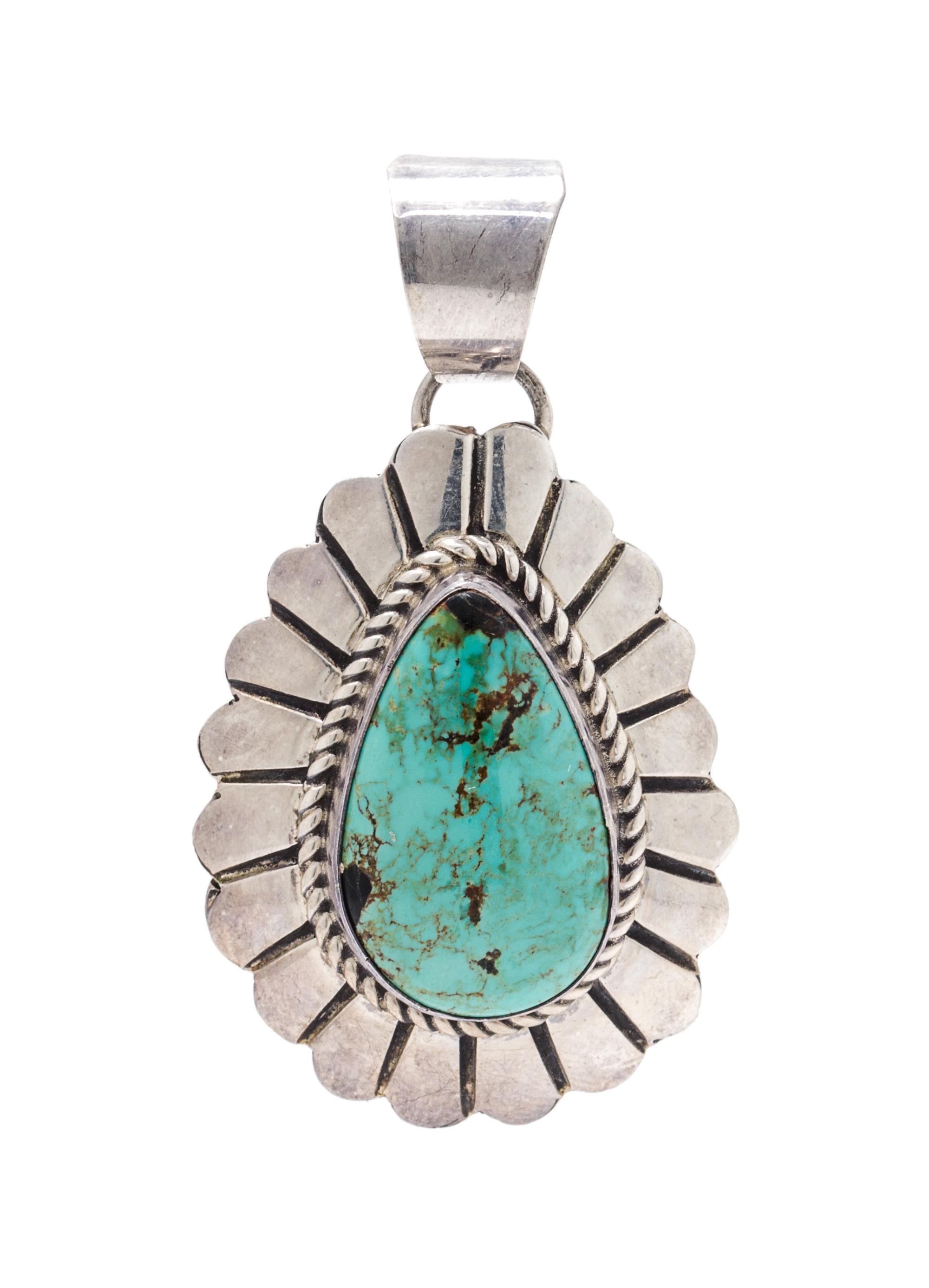 A Sterling Silver and Turquoise Pendant, Marcella James, Navajo, 8.10 dwts.