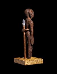 An Egyptian Wood Figure of a Youth