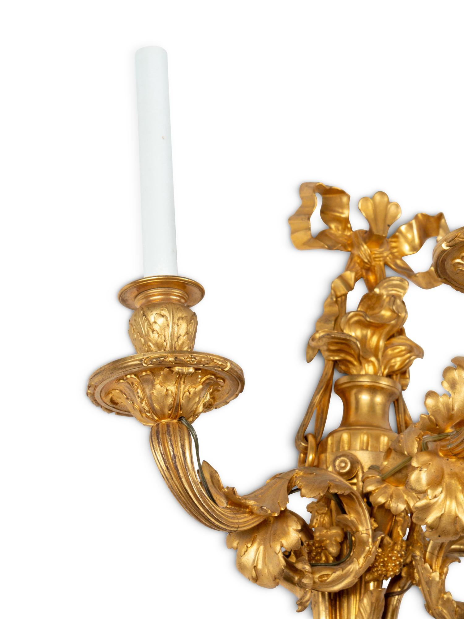 A Pair of Louis XVI Style Gilt Bronze Three-Light Sconces