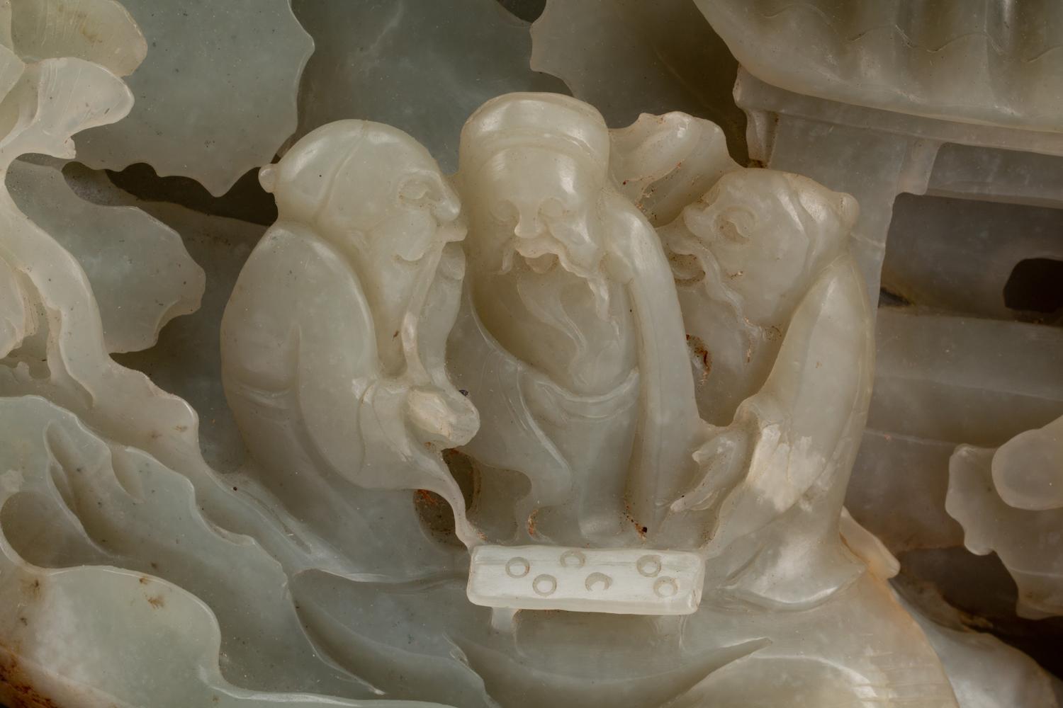 A Chinese Carved Hardstone Figural Group on a Wood Base