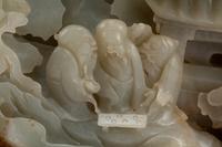 A Chinese Carved Hardstone Figural Group on a Wood Base
