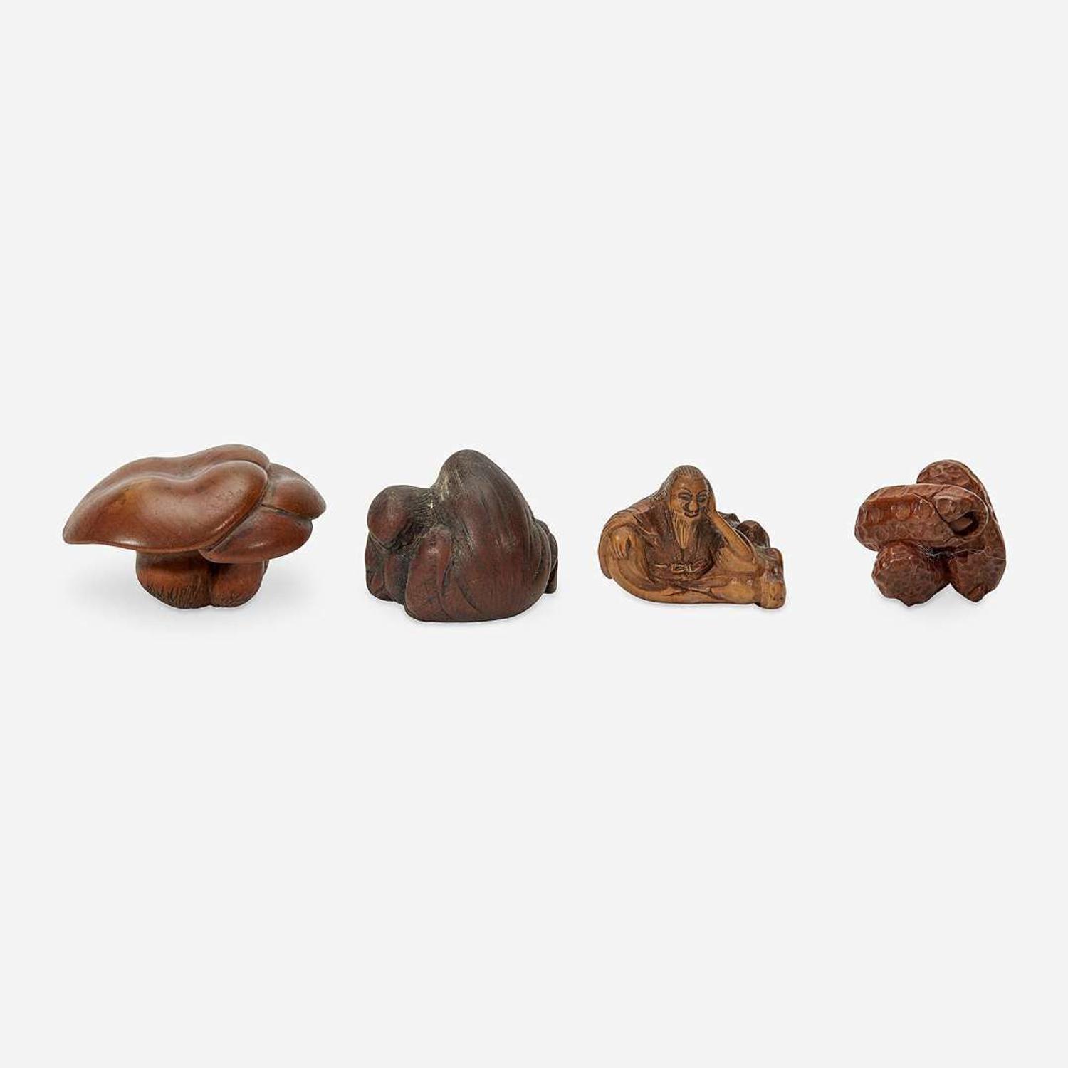 Four Japanese carved wood netsuke