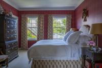 A Damask Upholstered Sofa with Buillon Fringe