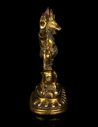 A Tibetan Gilt Bronze and Silver Inlaid Figure of Yama Dharmaraja