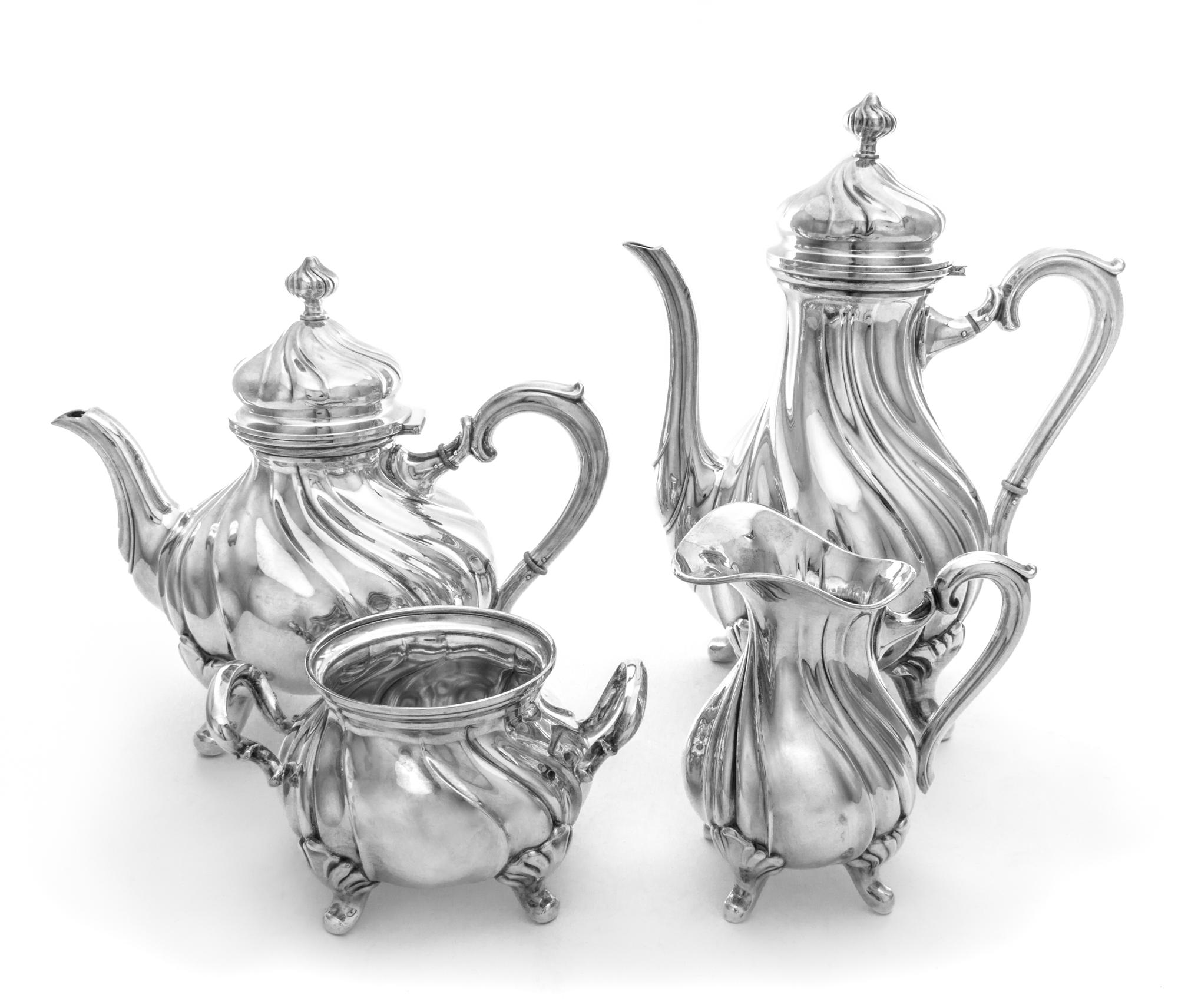 A German Silver Four Piece Tea and Coffee Service, Gebruder Kuhn, Scwabisch Gmund,, each of baluster form with twist decoration and rai