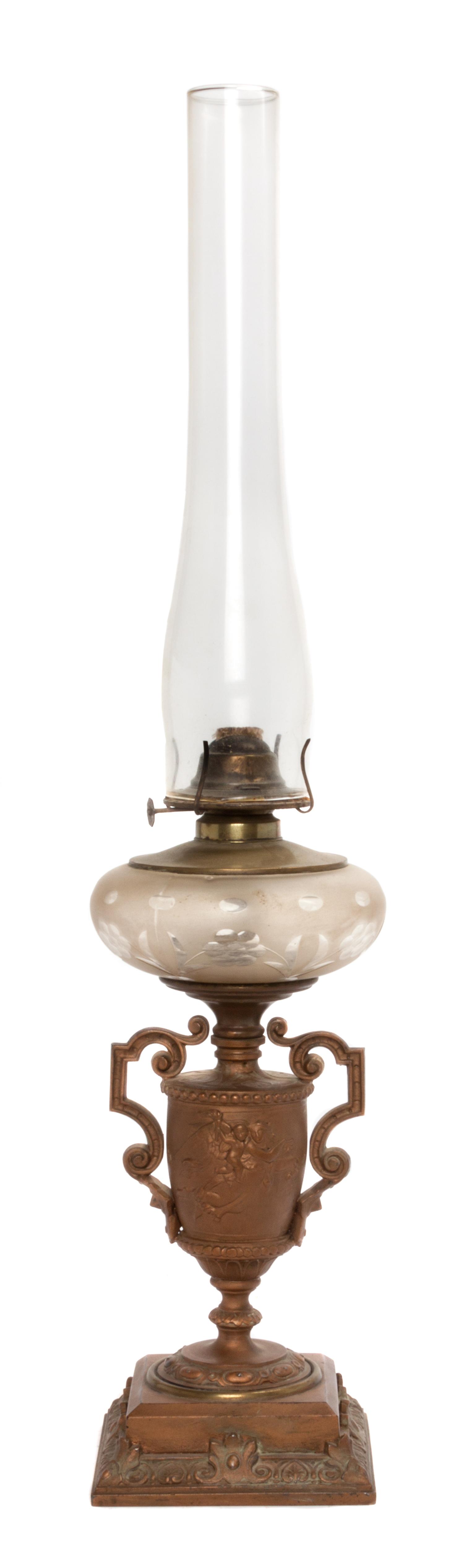 A Continental Neoclassical Gilt Metal Fluid Lamp Height overall 28 1/4 inches.