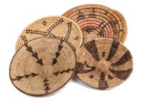 Four Southwestern Basket Trays Diameter of largest 13 1/2 inches.