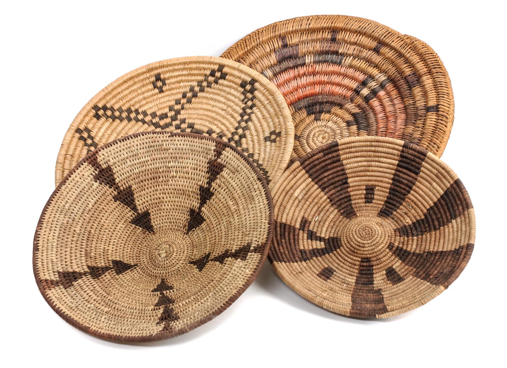 Four Southwestern Basket Trays Diameter of largest 13 1/2 inches.